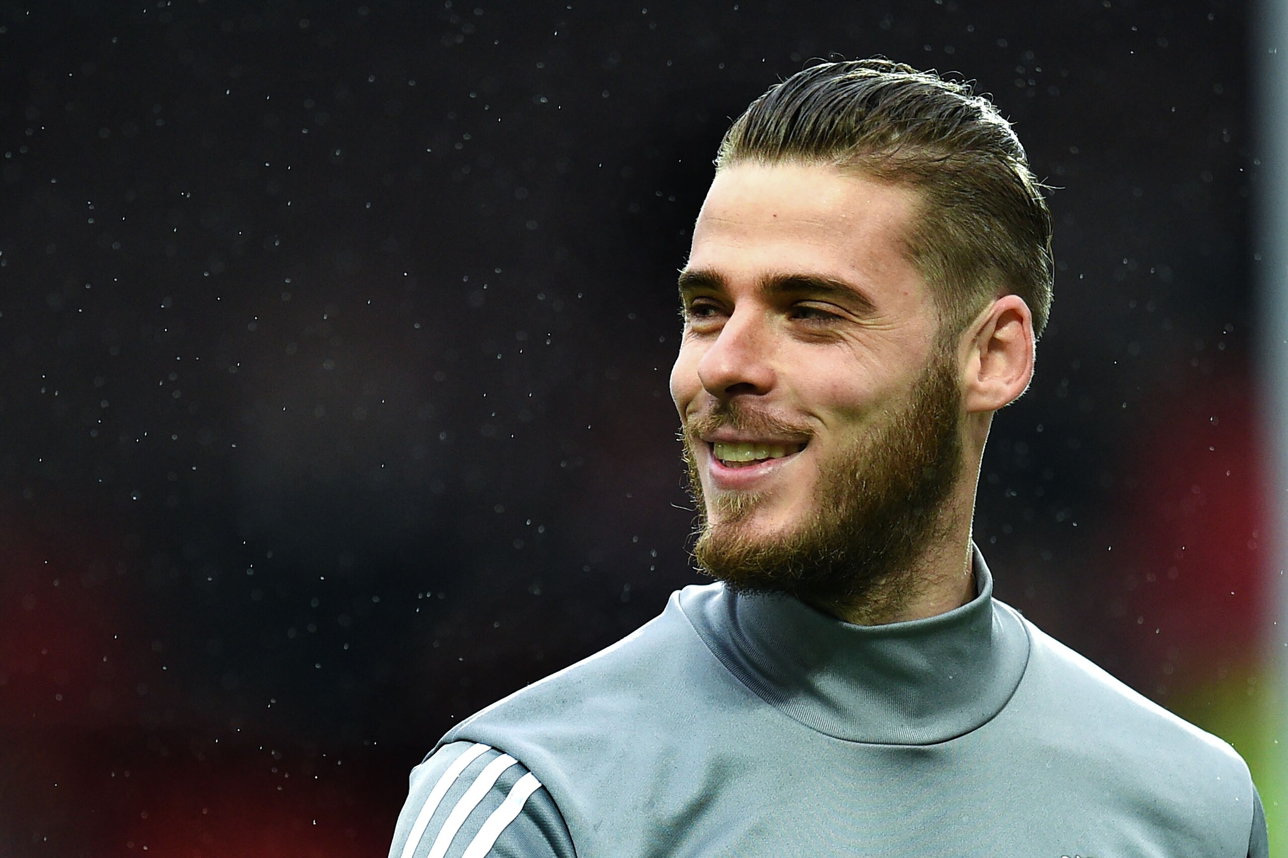 Manchester United's Spanish goalkeeper David de Gea warms up ahead of the English Premier League football match between Manchester United and Tottenham Hotspur at Old Trafford in Manchester, north west England, on October 28, 2017. / AFP PHOTO / Oli SCARFF / RESTRICTED TO EDITORIAL USE. No use with unauthorized audio, video, data, fixture lists, club/league logos or 'live' services. Online in-match use limited to 75 images, no video emulation. No use in betting, games or single club/league/player publications.  /         (Photo credit should read OLI SCARFF/AFP/Getty Images)