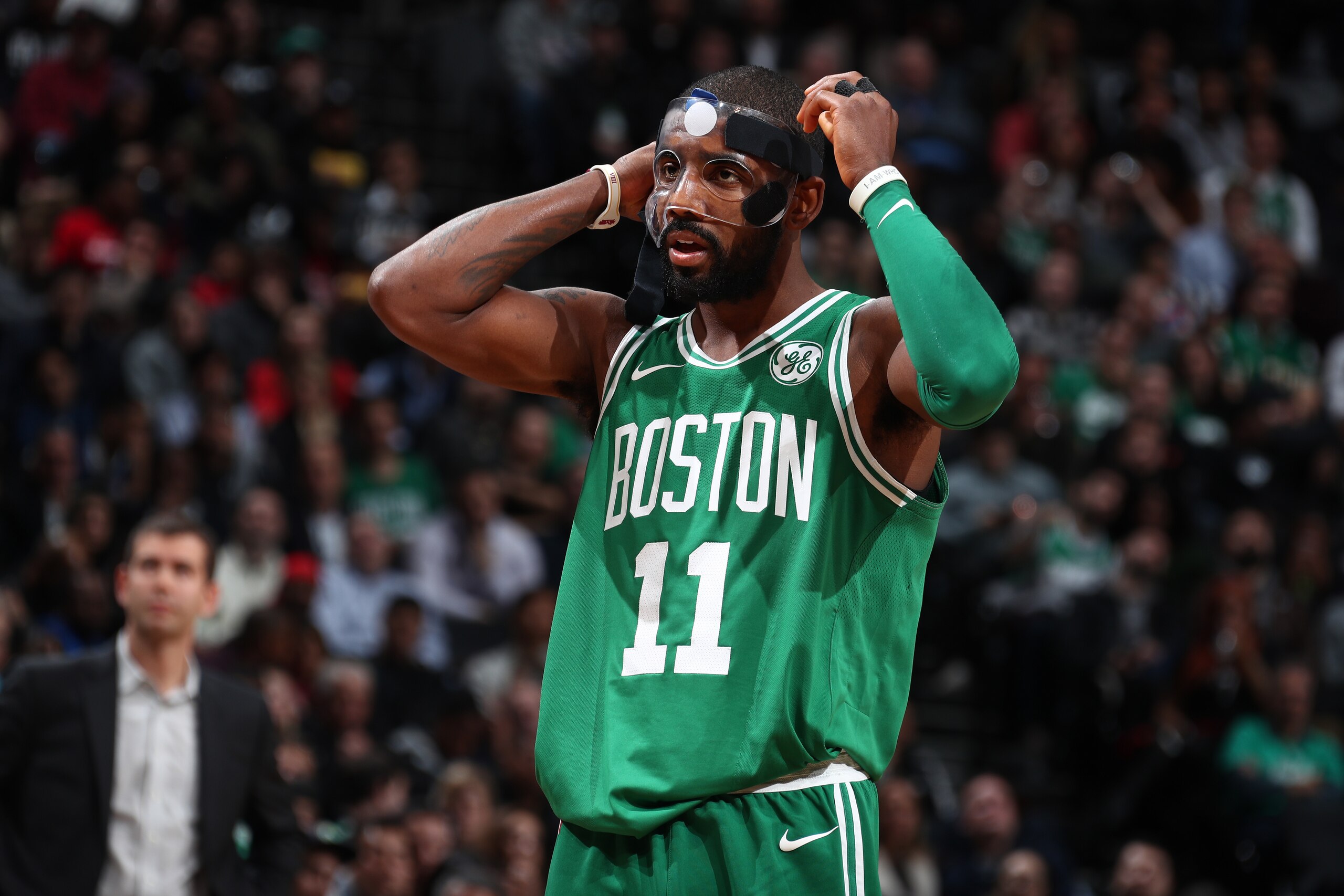 BROOKLYN, NY - NOVEMBER 14:  Kyrie Irving #11 of the Boston Celtics fixes his mask during the game against the Brooklyn Nets on November 14, 2017 at Barclays Center in Brooklyn, New York. NOTE TO USER: User expressly acknowledges and agrees that, by downloading and or using this Photograph, user is consenting to the terms and conditions of the Getty Images License Agreement. Mandatory Copyright Notice: Copyright 2017 NBAE (Photo by Nathaniel S. Butler/NBAE via Getty Images)