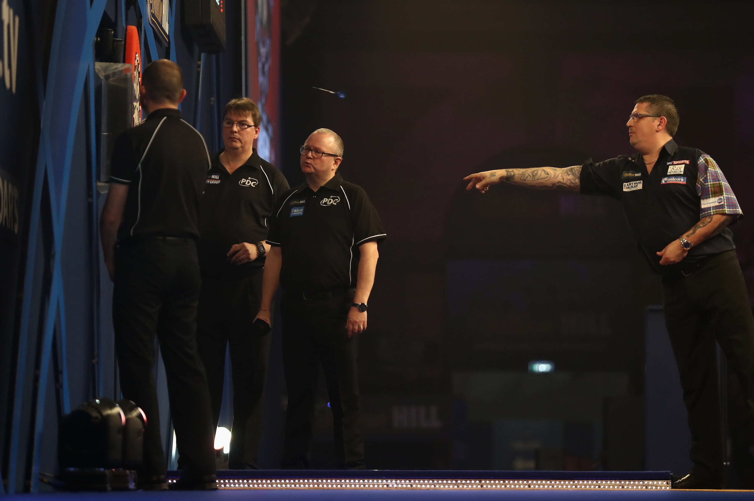 LONDON, ENGLAND - JANUARY 02:  Gary Anderson of Great Britain throws Michael van Gerwen of The Netherlands during the final of the 2017 William Hill PDC World Darts Championships at Alexandra Palace on January 2, 2017 in London, England.  (Photo by Bryn Lennon/Getty Images)