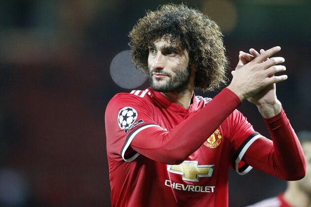 Manchester United's Marouane Fellaini greets the audience at the end of the Champions League group A soccer match between Manchester United and Basel, at the Old Trafford stadium in Manchester, Tuesday, Sept. 12, 2017. (AP Photo/Frank Augstein)