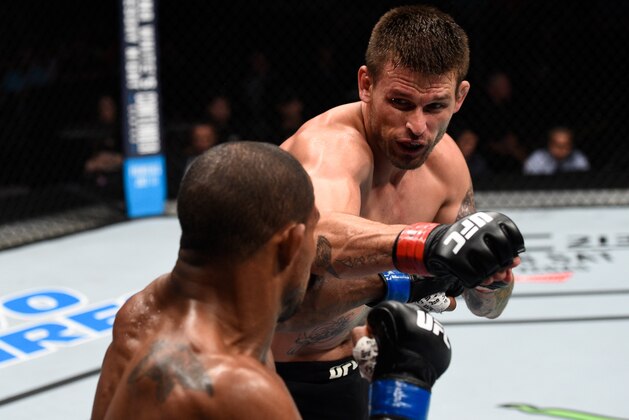 OKLAHOMA CITY, OK - JUNE 25:   (R-L) Tim Means punches Alex Garcia of the Dominican Republic in their welterweight bout during the UFC Fight Night event at the Chesapeake Energy Arena on June 25, 2017 in Oklahoma City, Oklahoma. (Photo by Brandon Magnus/Zuffa LLC/Zuffa LLC via Getty Images)