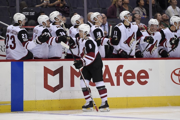 Arizona Coyotes center Clayton Keller (9) celebrates his goal with the bench during the first period of an NHL hockey game against the Washington Capitals, Monday, Nov. 6, 2017, in Washington. (AP Photo/Nick Wass)