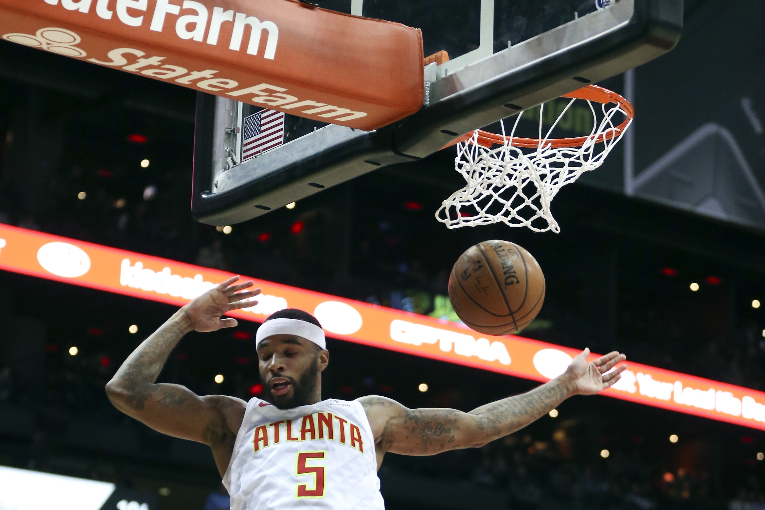 Atlanta Hawks guard Malcolm Delaney (5) scores against the Sacramento Kings during the first half of an NBA basketball game Wednesday, Nov. 15, 2017, in Atlanta. (AP Photo/John Bazemore)