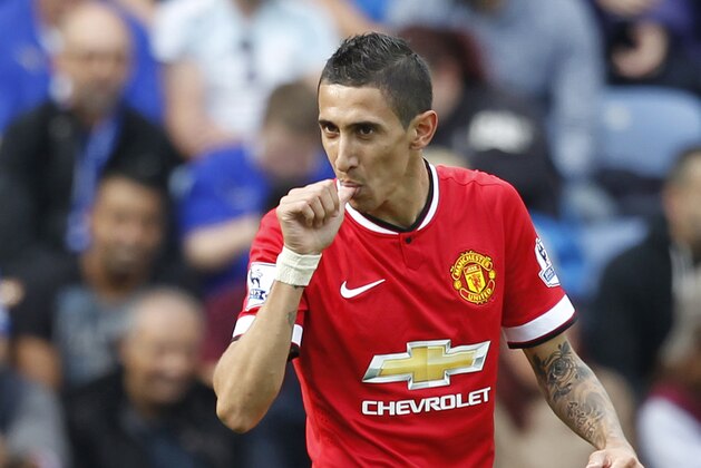 Manchester United's Argentinian midfielder Angel Di Maria celebrates scoring their second goal during the English Premier League football match between Leicester City and Manchester United at the King Power Stadium in Leicester on September 21, 2014. AFP PHOTO/IAN KINGTON

RESTRICTED TO EDITORIAL USE. No use with unauthorized audio, video, data, fixture lists, club/league logos or live services. Online in-match use limited to 45 images, no video emulation. No use in betting, games or single club/league/player publications. / AFP PHOTO / IAN KINGTON        (Photo credit should read IAN KINGTON/AFP/Getty Images)