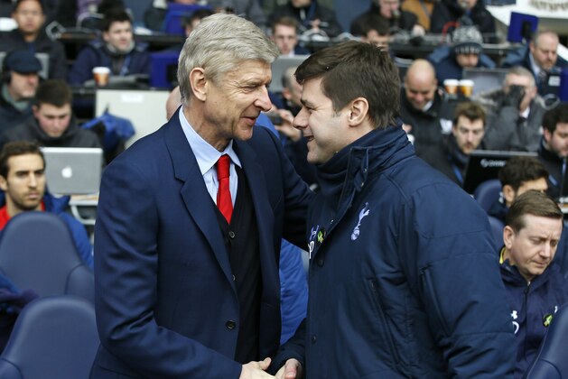 Arsenal's head coach Arsene Wenger, left, shakes hands with Tottenham’s manager Mauricio Pochettino before the English Premier League soccer match between Tottenham Hotspur and Arsenal at the White Hart Lane stadium in London, Saturday, Feb. 7, 2015. (AP Photo/Alastair Grant)