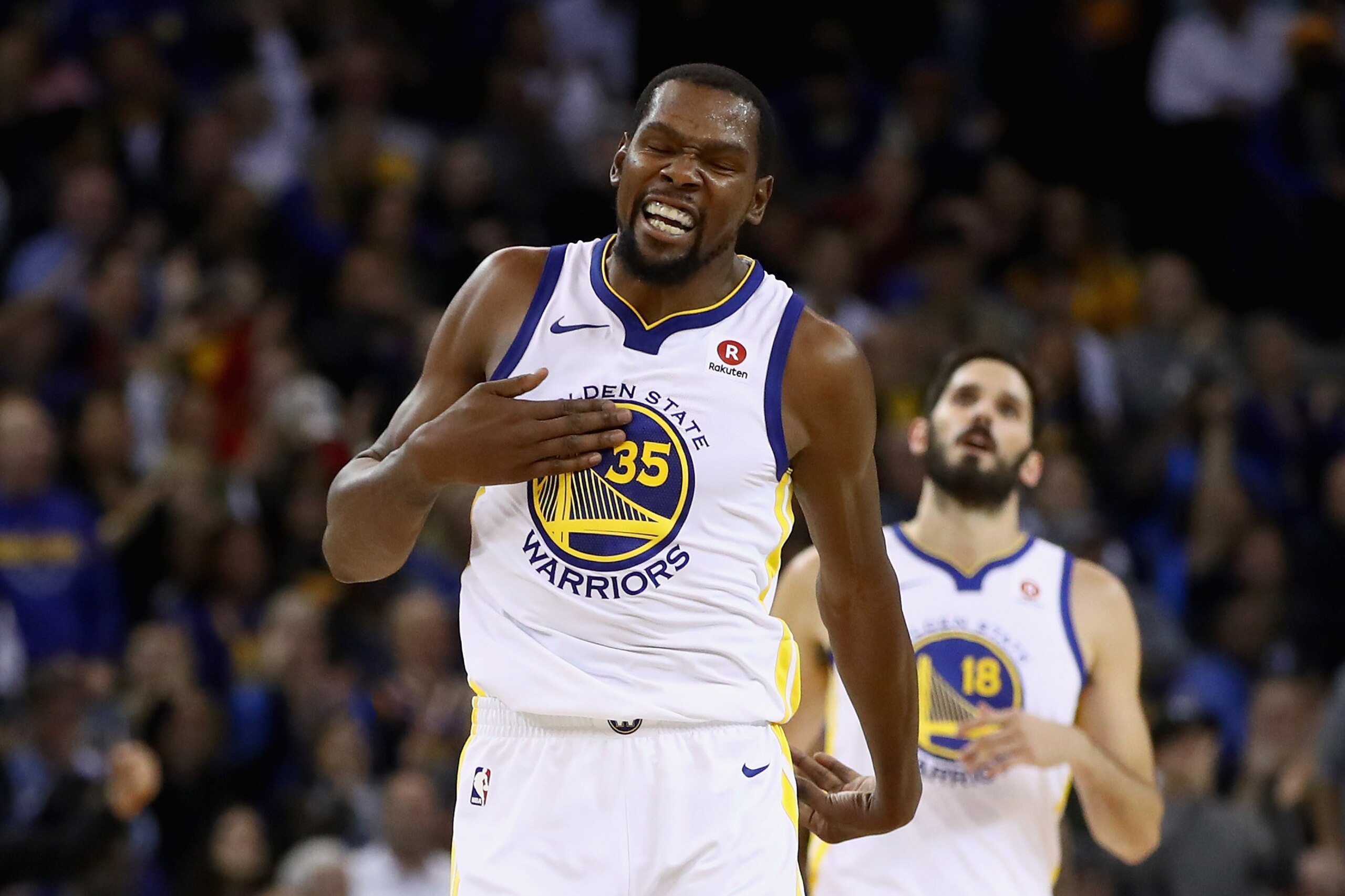 OAKLAND, CA - NOVEMBER 13:  Kevin Durant #35 of the Golden State Warriors reacts after teammate Shaun Livingston #34 dunked the ball against the Orlando Magic at ORACLE Arena on November 13, 2017 in Oakland, California. NOTE TO USER: User expressly acknowledges and agrees that, by downloading and or using this photograph, User is consenting to the terms and conditions of the Getty Images License Agreement.  (Photo by Ezra Shaw/Getty Images)