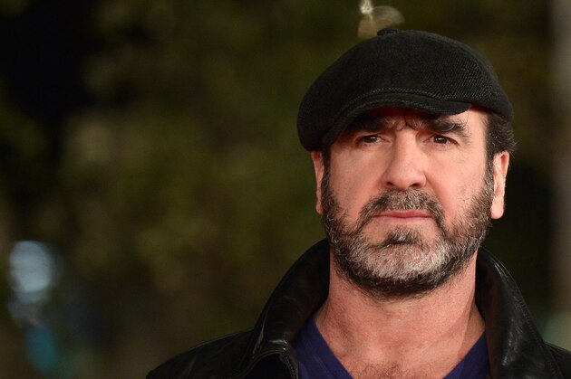 French former football player and actor Eric Cantona poses on the red carpet as he arrives for the screening of the movie 'Mad Kings'' during the Rome Film Festival, on October 19, 2015  in Rome. AFP PHOTO/ TIZIANA FABI / AFP PHOTO / Tiziana FABI        (Photo credit should read TIZIANA FABI/AFP/Getty Images)