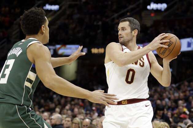 Cleveland Cavaliers' Kevin Love (0) looks to pass against Milwaukee Bucks' Malcolm Brogdon (13) in the first half of an NBA basketball game, Tuesday, Nov. 7, 2017, in Cleveland. (AP Photo/Tony Dejak)