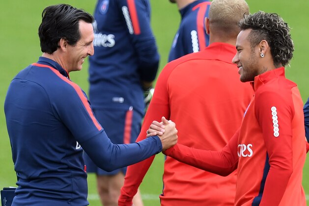 Paris Saint-Germain's Brazilian forward Neymar (R) shakes hands with Paris Saint-Germain's Spanish head coach Unai Emery (L) during a training session at the Camp des Loges in Saint-Germain-en-Laye, near Paris, on August 11, 2017.  / AFP PHOTO / ALAIN JOCARD        (Photo credit should read ALAIN JOCARD/AFP/Getty Images)