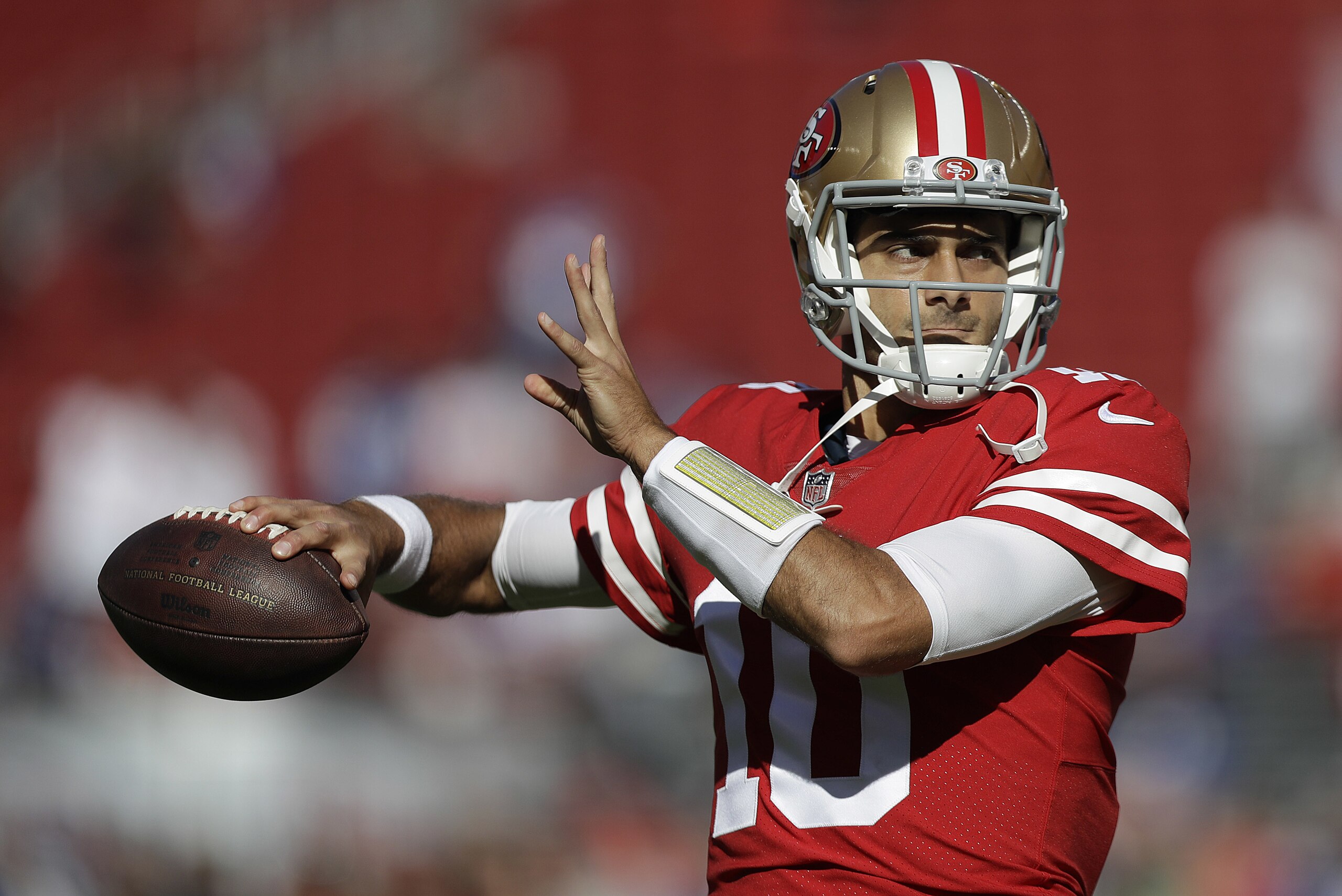 San Francisco 49ers quarterback Jimmy Garoppolo (10) warms up before an NFL football game against the New York Giants in Santa Clara, Calif., Sunday, Nov. 12, 2017. (AP Photo/Marcio Jose Sanchez)