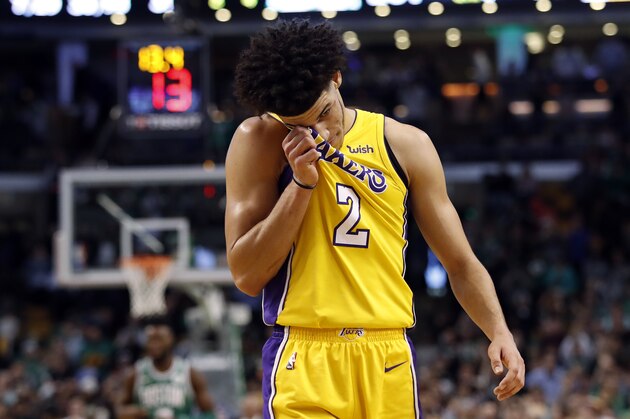 Los Angeles Lakers' Lonzo Ball wipes his face late in the fourth quarter of the Lakers' 107-96 loss to the Boston Celtics in an NBA basketball game in Boston on Wednesday, Nov. 8, 2017. (AP Photo/Winslow Townson)