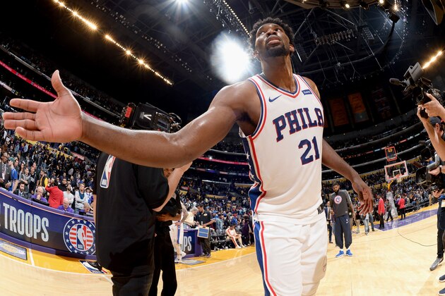 LOS ANGELES, CA - NOVEMBER 15:  Joel Embiid #21 of the Philadelphia 76ers high fives with the Los Angeles Lakers after the game on November 15, 2017 at STAPLES Center in Los Angeles, California. NOTE TO USER: User expressly acknowledges and agrees that, by downloading and/or using this Photograph, user is consenting to the terms and conditions of the Getty Images License Agreement. Mandatory Copyright Notice: Copyright 2017 NBAE (Photo by Andrew D. Bernstein/NBAE via Getty Images)