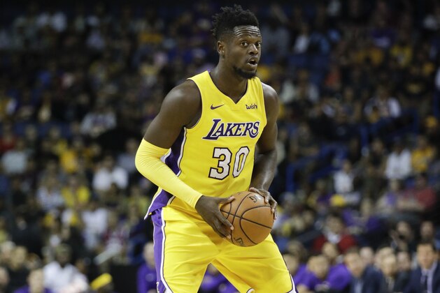 Los Angeles Lakers' Julius Randle looks to pass during the second half of an NBA preseason basketball game against the Denver Nuggets, Wednesday, Oct. 4, 2017, in Ontario, Calif. (AP Photo/Jae C. Hong)
