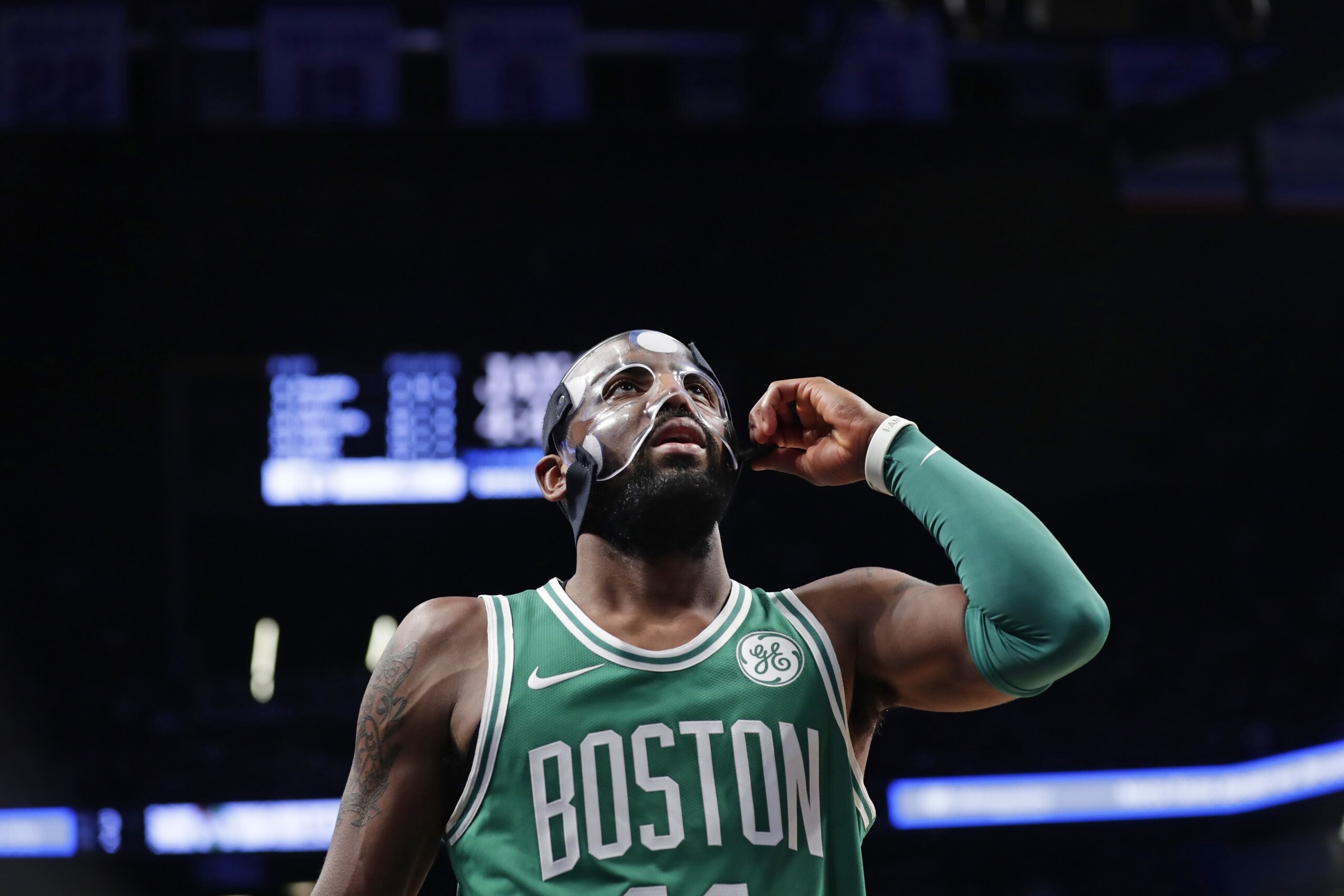 Boston Celtics' Kyrie Irving (11) adjusts his mask during the second half of the team's NBA basketball game against the Brooklyn Nets on Tuesday, Nov. 14, 2017, in New York. The Celtics won 109-102. (AP Photo/Frank Franklin II)