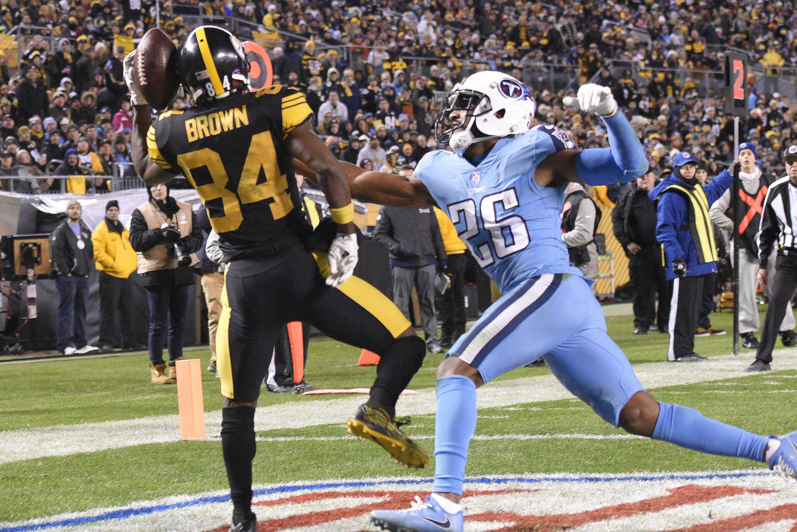 Pittsburgh Steelers wide receiver Antonio Brown (84) comes down with a touchdown with Tennessee Titans cornerback Logan Ryan (26) defending during the second half of an NFL football game in Pittsburgh, Thursday, Nov. 16, 2017. (AP Photo/Don Wright)