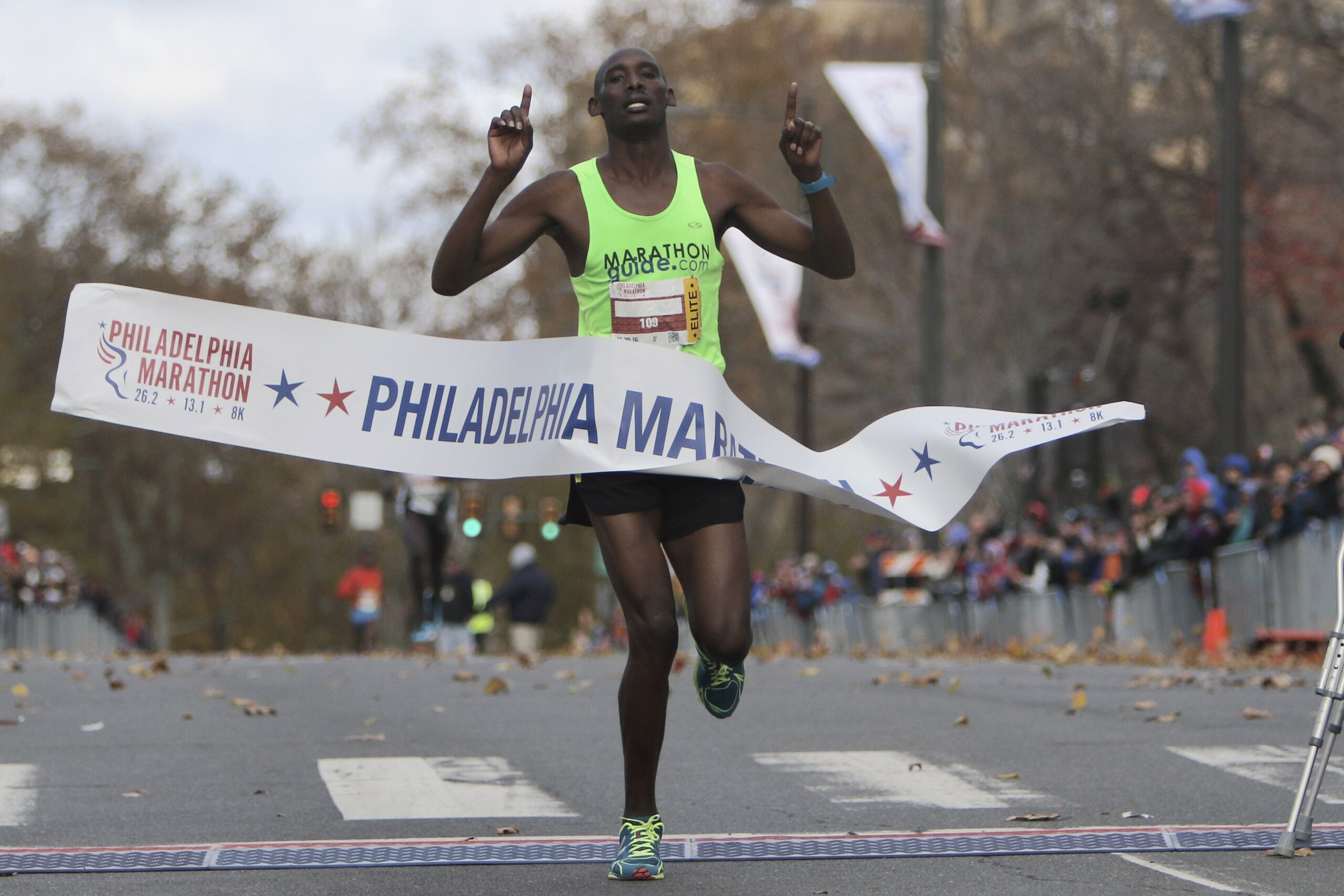 Kimutai Cheruiyot reacts as he crossed to win the Philadelphia Marathon with an unofficial course record finish time of 2:15:52, Sunday Nov. 20, 2016, in Philadelphia. (AP Photo/ Joseph Kaczmarek)