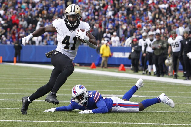 FILE - In this Nov. 12, 2017, file photo, New Orleans Saints running back Alvin Kamara (41) rushes past Buffalo Bills' Shareece Wright (20) during the first half of an NFL football game in Orchard Park, N.Y. As usual, Drew Brees has the passing game humming, and the contributions of the running back tandem of Mark Ingram and rookie Alvin Kamara has made New Orleans even more dynamic with the ball. The Washington Redskins play at New Orleans on Sunday.(AP Photo/Jeffrey T. Barnes, File)