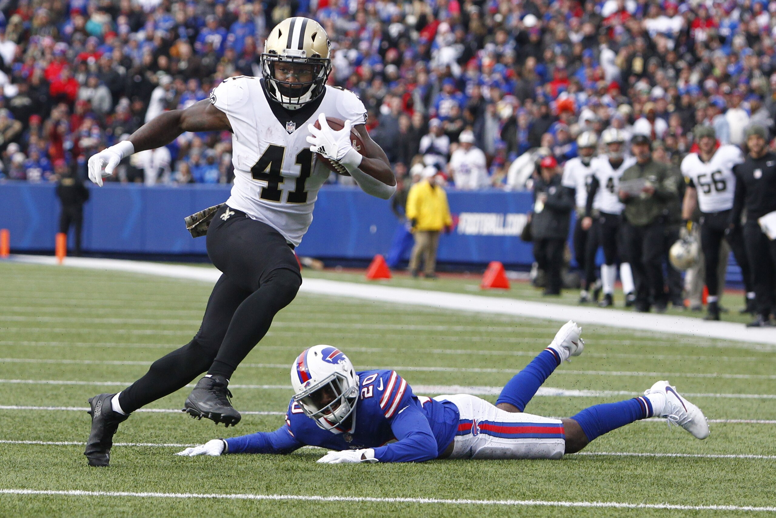 FILE - In this Nov. 12, 2017, file photo, New Orleans Saints running back Alvin Kamara (41) rushes past Buffalo Bills' Shareece Wright (20) during the first half of an NFL football game in Orchard Park, N.Y. As usual, Drew Brees has the passing game humming, and the contributions of the running back tandem of Mark Ingram and rookie Alvin Kamara has made New Orleans even more dynamic with the ball. The Washington Redskins play at New Orleans on Sunday.(AP Photo/Jeffrey T. Barnes, File)