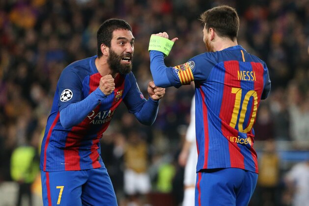 BARCELONA, SPAIN - MARCH 8: Arda Turan and Lionel Messi of FC Barcelona celebrate the victory following the UEFA Champions League Round of 16 second leg match between FC Barcelona and Paris Saint-Germain (PSG) at Camp Nou on March 8, 2017 in Barcelona, Spain. (Photo by Jean Catuffe/Getty Images)