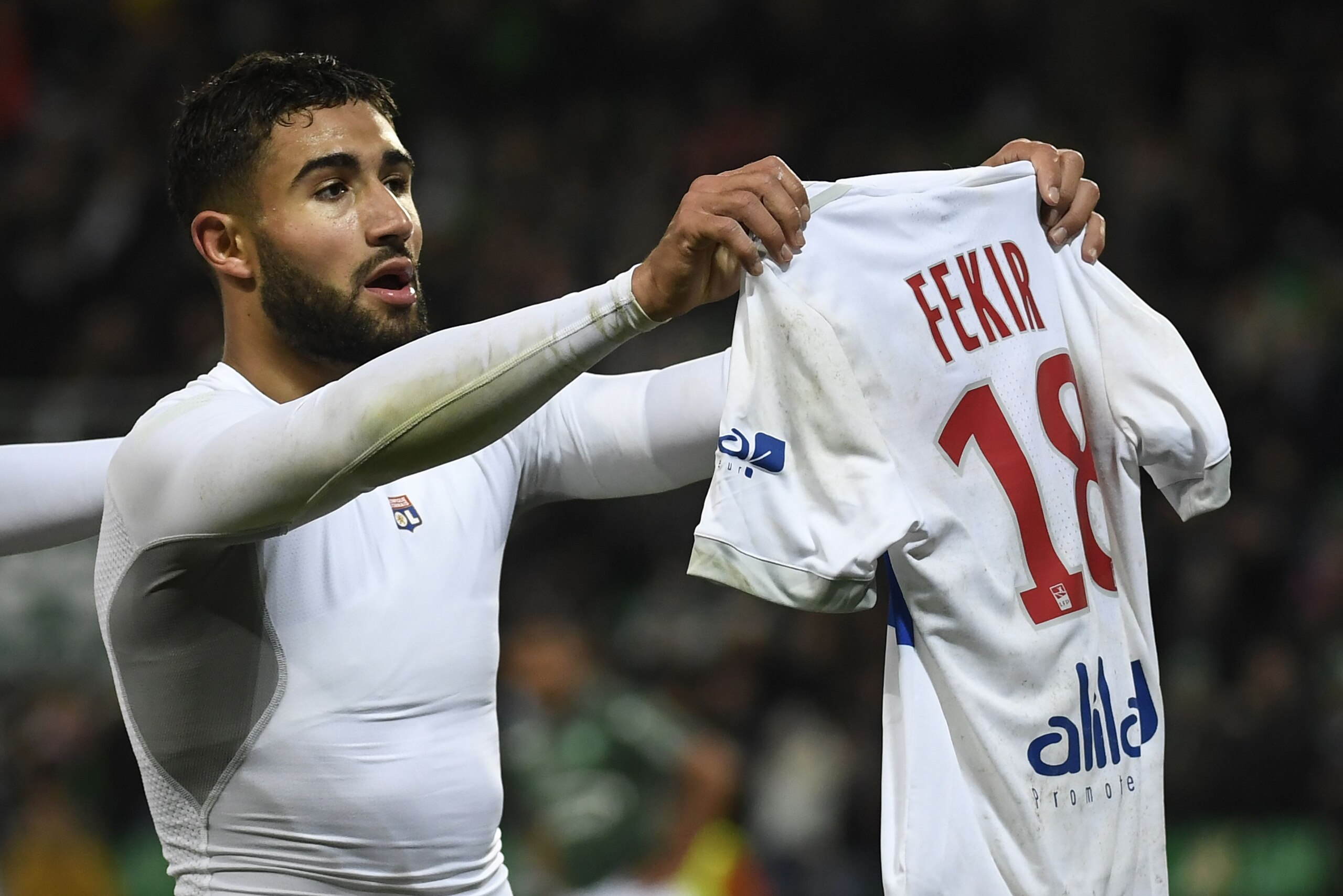 Lyon's French midfielder Nabil Fekir shows his shirt after scoring during the French L1 football match between AS Saint-Etienne and Olympique Lyonnais, on November 5, 2017, at the Geoffroy Guichard stadium in Saint-Etienne, central France. / AFP PHOTO / PHILIPPE DESMAZES (Photo credit should read PHILIPPE DESMAZES/AFP/Getty Images) Lyon's French midfielder Nabil Fekir shows his shirt after scoring during the French L1 football match between AS Saint-Etienne and Olympique Lyonnais, on November 5, 2017, at the Geoffroy Guichard stadium in Saint-Etienne, central France. / AFP PHOTO / PHILIPPE DESMAZES (Photo credit should read PHILIPPE DESMAZES/AFP/Getty Images)