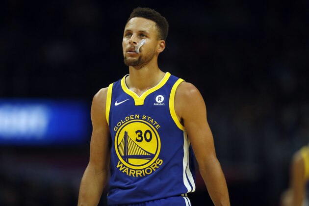 Golden State Warriors guard Stephen Curry chews on his mouthguard during the second half of an NBA basketball game against the Los Angeles Clippers, Monday, Oct. 30, 2017, in Los Angeles. (AP Photo/Ryan Kang)