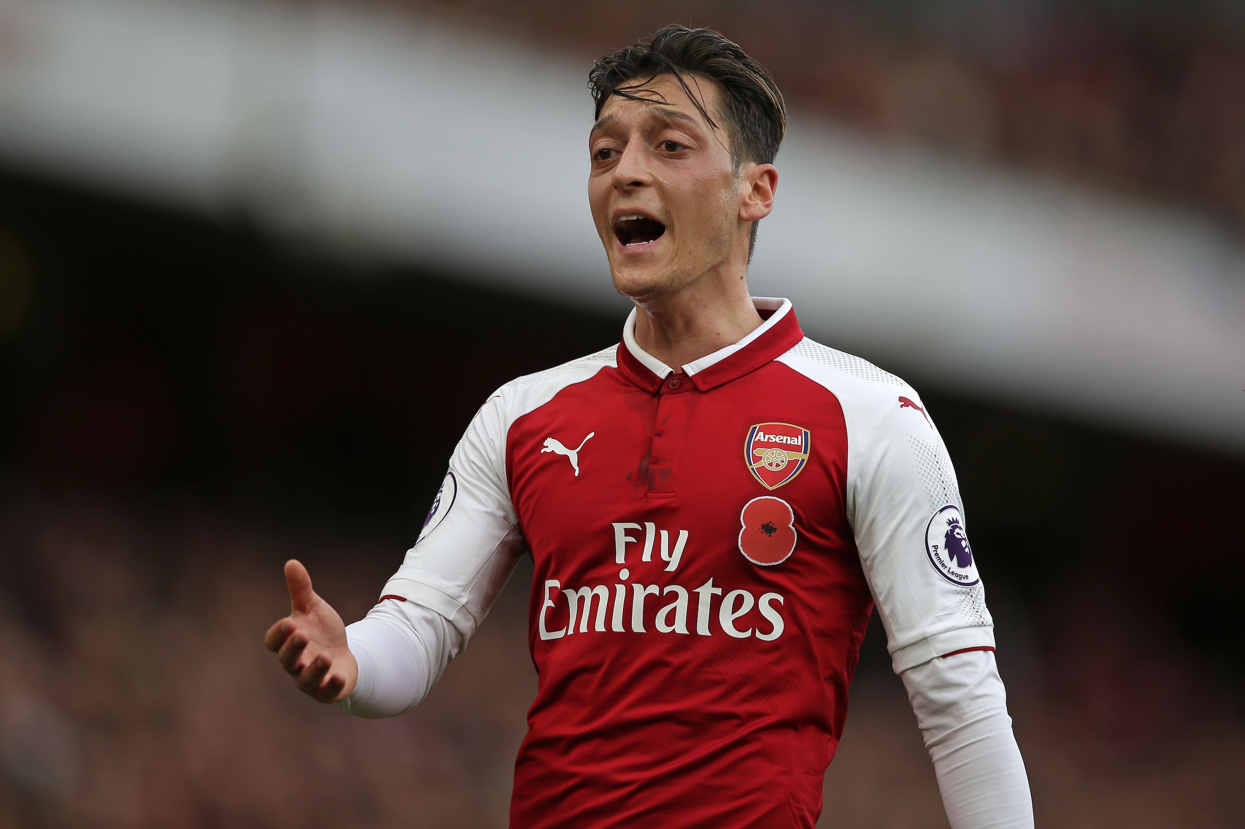 Arsenal's German midfielder Mesut Ozil gestures during the English Premier League football match between Arsenal and Swansea City at the Emirates Stadium in London on October 28, 2017.  / AFP PHOTO / Daniel LEAL-OLIVAS / RESTRICTED TO EDITORIAL USE. No use with unauthorized audio, video, data, fixture lists, club/league logos or 'live' services. Online in-match use limited to 75 images, no video emulation. No use in betting, games or single club/league/player publications.  /         (Photo credit should read DANIEL LEAL-OLIVAS/AFP/Getty Images)