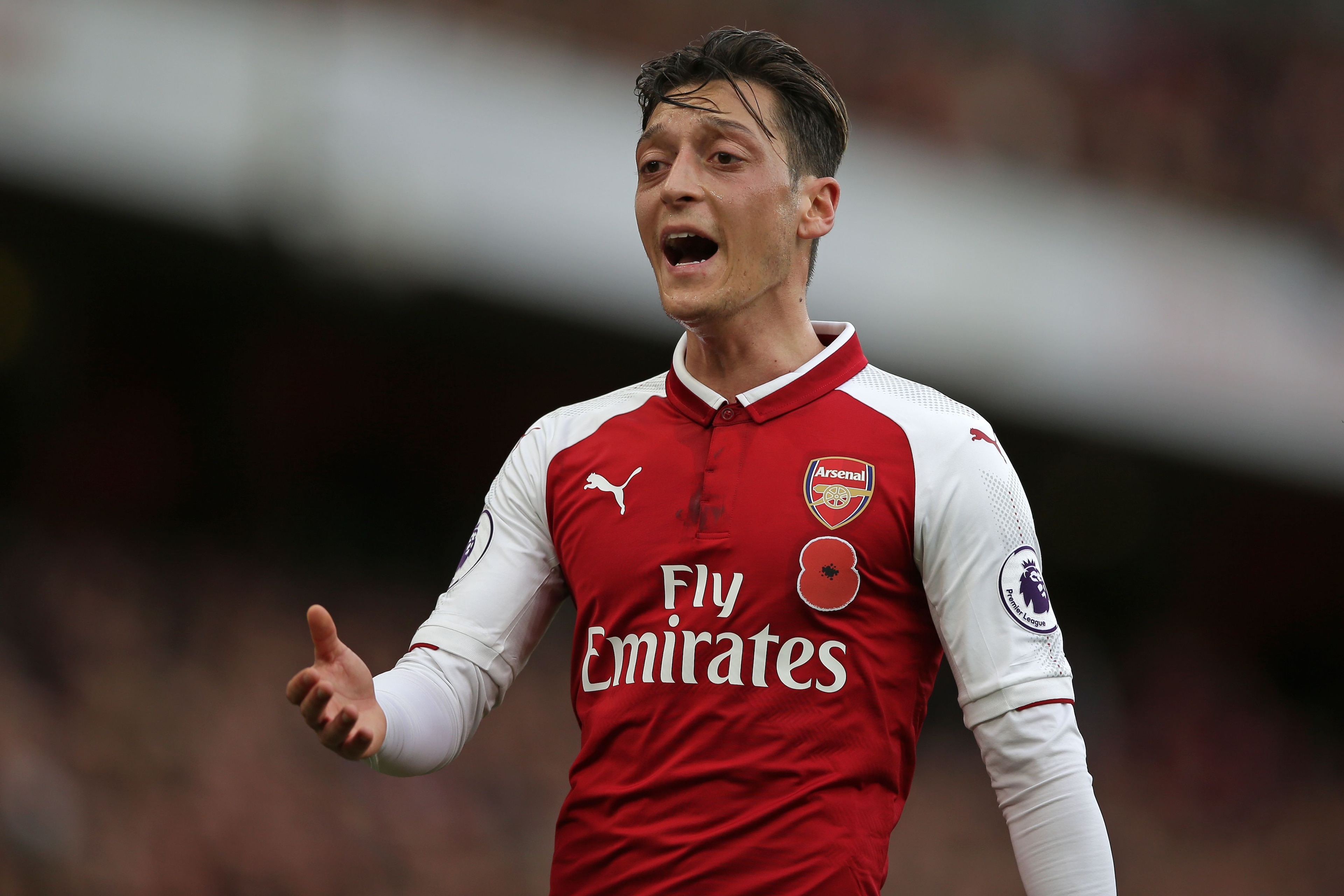 Arsenal's German midfielder Mesut Ozil gestures during the English Premier League football match between Arsenal and Swansea City at the Emirates Stadium in London on October 28, 2017.  / AFP PHOTO / Daniel LEAL-OLIVAS / RESTRICTED TO EDITORIAL USE. No use with unauthorized audio, video, data, fixture lists, club/league logos or 'live' services. Online in-match use limited to 75 images, no video emulation. No use in betting, games or single club/league/player publications.  /         (Photo credit should read DANIEL LEAL-OLIVAS/AFP/Getty Images)