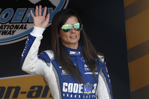 Danica Patrick waves to the crowd during driver introductions prior to a NASCAR Cup Series auto race at Phoenix International Raceway Sunday, Nov. 12, 2017, in Avondale, Ariz. (AP Photo/Ross D. Franklin)