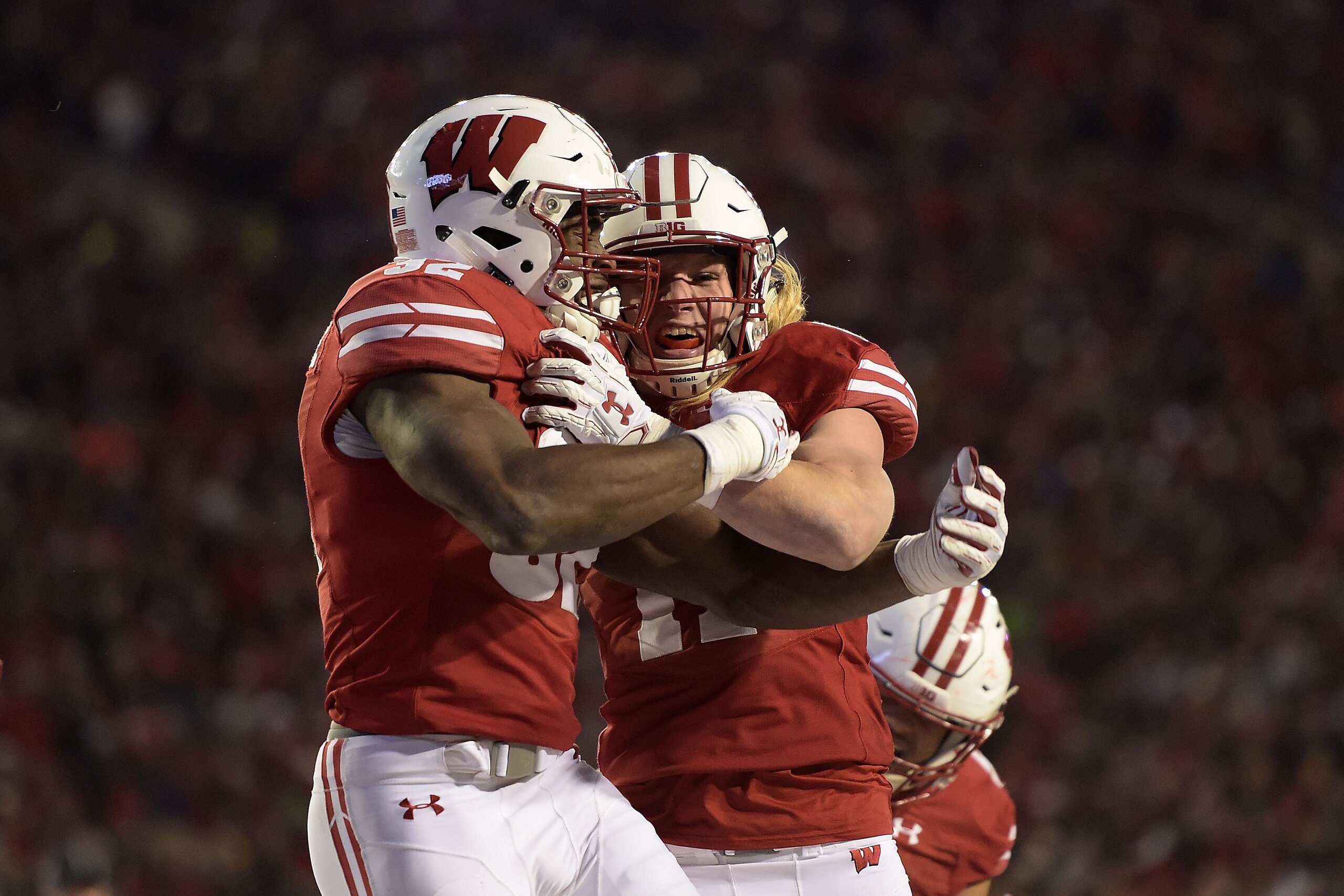 MADISON, WI - NOVEMBER 11: Leon Jacobs #32 of the Wisconsin Badgers is congratulated by Andrew Van Ginkel #17 following a touchdown against the Iowa Hawkeyes during the third quarter of a game at Camp Randall Stadium on November 11, 2017 in Madison, Wisconsin. (Photo by Stacy Revere/Getty Images) MADISON, WI - NOVEMBER 11: Leon Jacobs #32 of the Wisconsin Badgers is congratulated by Andrew Van Ginkel #17 following a touchdown against the Iowa Hawkeyes during the third quarter of a game at Camp Randall Stadium on November 11, 2017 in Madison, Wisconsin. (Photo by Stacy Revere/Getty Images)
