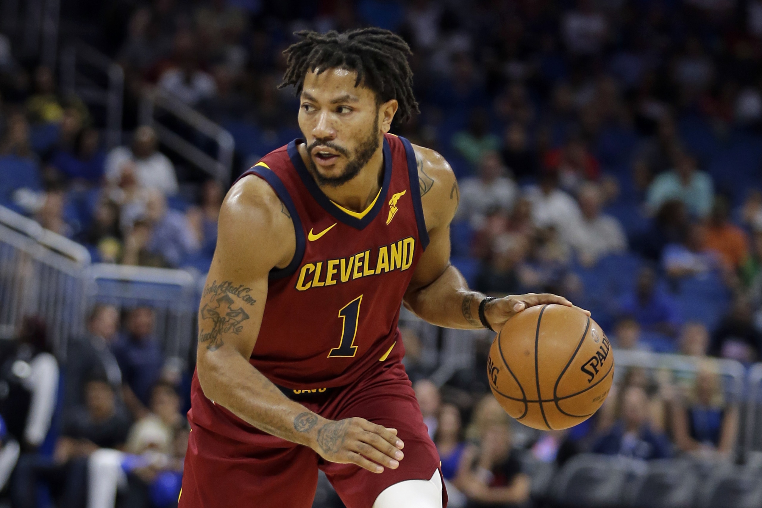 Cleveland Cavaliers' Derrick Rose moves the ball against the Orlando Magic during the first half of an NBA preseason basketball game, Friday, Oct. 13, 2017, in Orlando, Fla. (AP Photo/John Raoux)