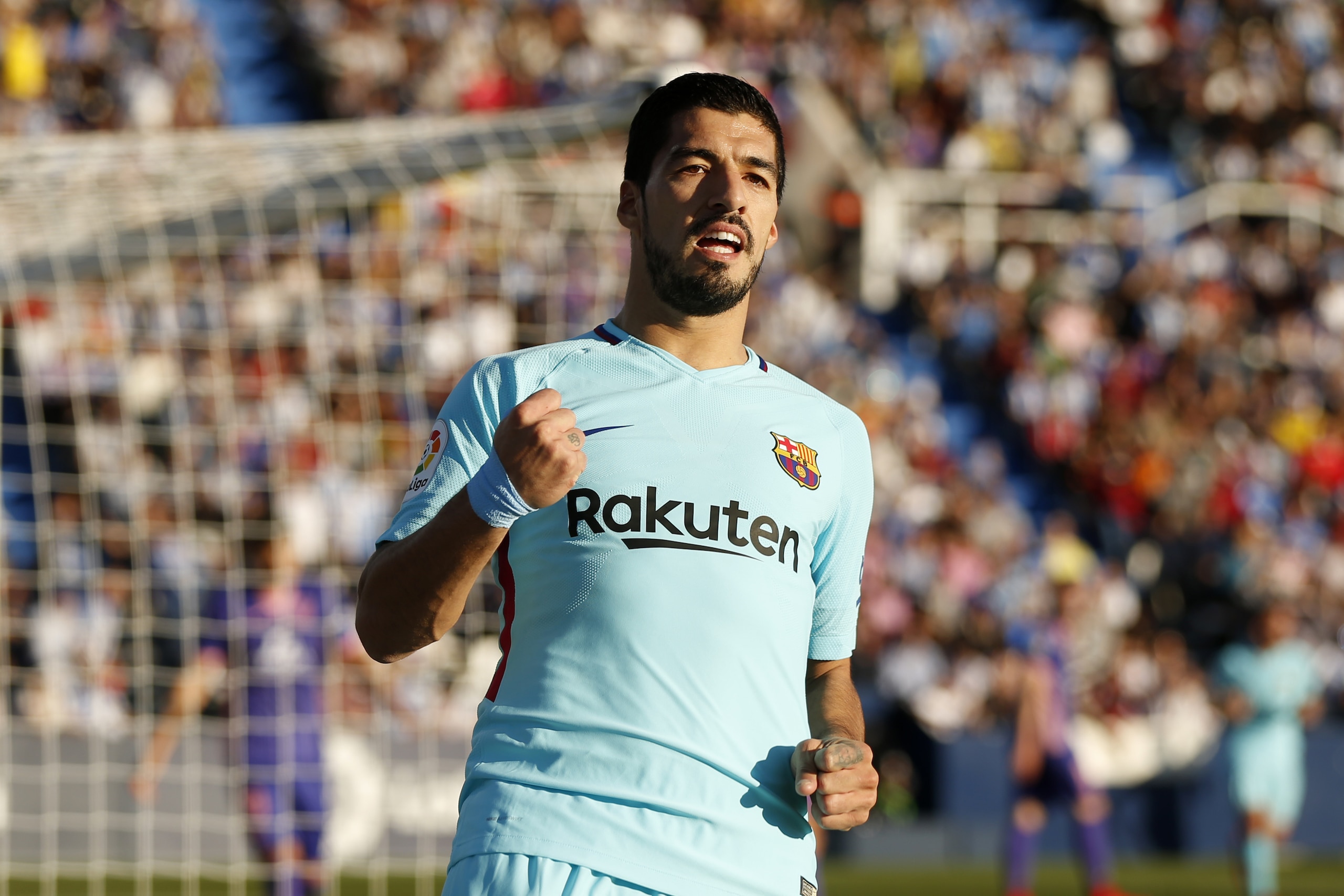 Barcelona's Luis Suarez celebrates after scoring the opening goal against Leganes during the Spanish La Liga soccer match between Barcelona and Leganes at the Butarque stadium in Madrid, Saturday, Nov 18, 2017. (AP Photo/Francisco Seco)