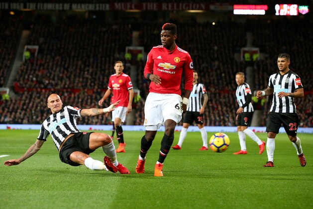 MANCHESTER, ENGLAND - NOVEMBER 18:  Jonjo Shelvey of Newcastle United and Paul Pogba of Manchester United in action during the Premier League match between Manchester United and Newcastle United at Old Trafford on November 18, 2017 in Manchester, England.  (Photo by Alex Livesey/Getty Images)