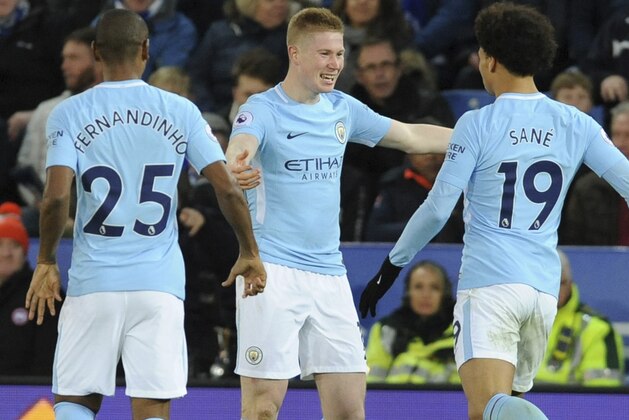 Manchester City's Kevin De Bruyne, centre, celebrates with teammates after scoring during the English Premier League soccer match between Leicester City and Manchester City at the King Power Stadium in Leicester, England, Saturday, Nov. 18, 2017. (AP Photo/Rui Vieira)