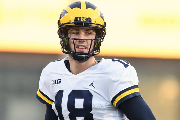 COLLEGE PARK, MD - NOVEMBER 11:  Brandon Peters #18 of the Michigan Wolverines looks on during a college football game against the Maryland Terrapins at Capitol One Field on November 11, 2017 in College Park, Maryland.  The Wolverines won 84-75.  (Photo by Mitchell Layton/Getty Images)