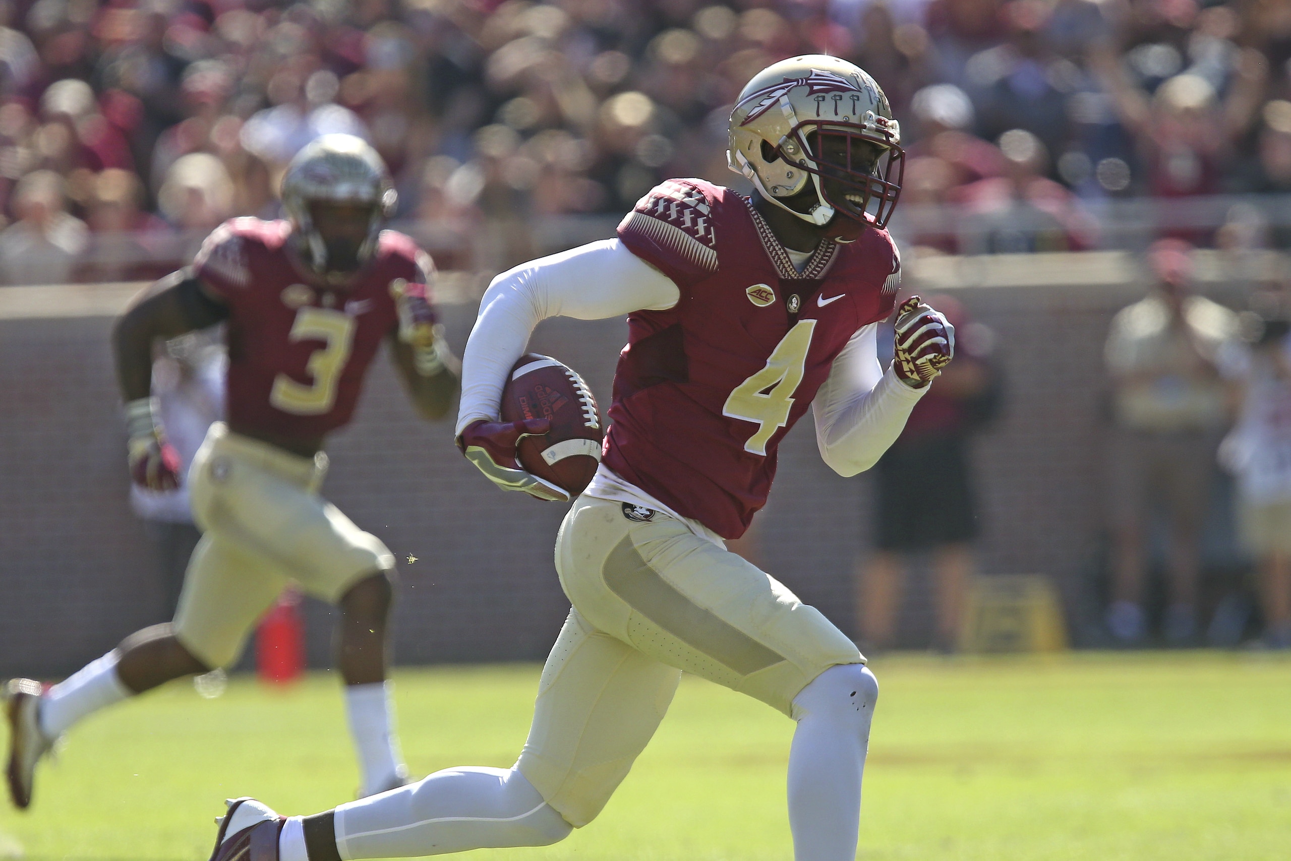Florida State's Tarvarus McFadden returns a blocked field goal attempt for a touchdown in the first quarter of an NCAA college football game with Delaware State, Saturday, Nov. 18, 2017, in Tallahassee Fla. (AP Photo/Steve Cannon)