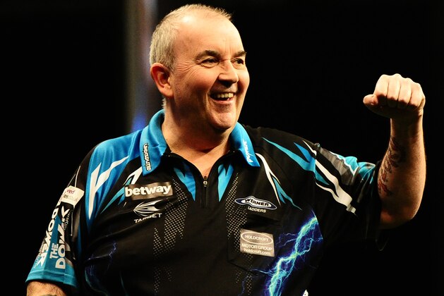 EXETER, UNITED KINGDOM - MARCH 02: Phil Taylor celebrates during Night Five of the Betway Premier League Darts at Westpoint Arena on March 2, 2017 in Exeter, England. (Photo by Harry Trump/Getty Images)