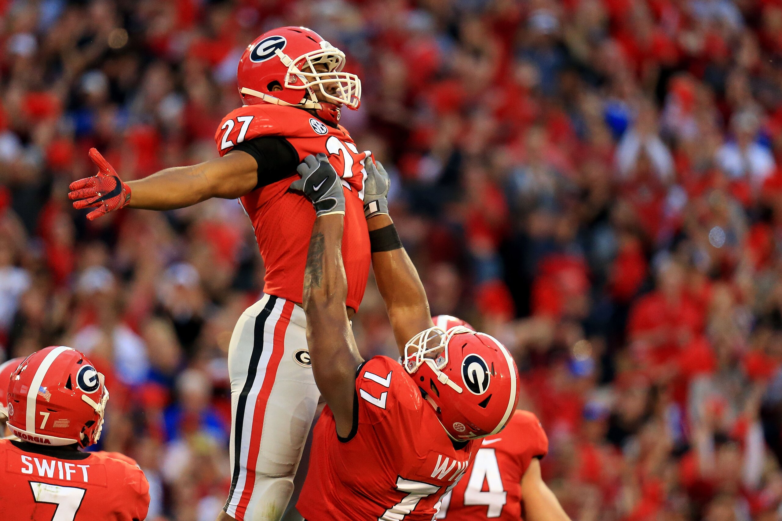 ATHENS, GA - NOVEMBER 18: Nick Chubb #27 celebrates a touchdown with Isaiah Wynn #77 of the Georgia Bulldogs during the first half against the Kentucky Wildcats at Sanford Stadium on November 18, 2017 in Athens, Georgia. (Photo by Daniel Shirey/Getty Images)