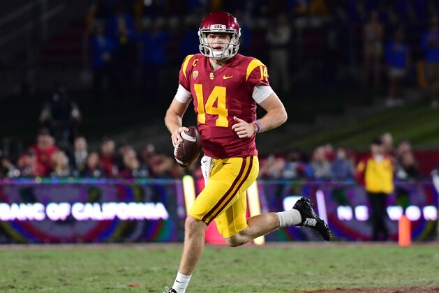 LOS ANGELES, CA - NOVEMBER 18:  Sam Darnold #14 of the USC Trojans scrambles out of the pocket during the second quarter against the UCLA Bruins at Los Angeles Memorial Coliseum on November 18, 2017 in Los Angeles, California.  (Photo by Harry How/Getty Images)