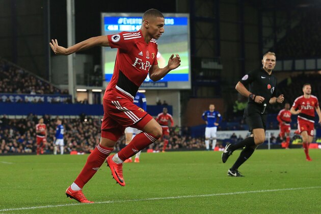 Watford's Brazilian striker Richarlison de Andrade celebrates scoring the opening goal during the English Premier League football match between Everton and Watford at Goodison Park in Liverpool, north west England on November 5, 2017. / AFP PHOTO / Lindsey PARNABY / RESTRICTED TO EDITORIAL USE. No use with unauthorized audio, video, data, fixture lists, club/league logos or 'live' services. Online in-match use limited to 75 images, no video emulation. No use in betting, games or single club/league/player publications.  /         (Photo credit should read LINDSEY PARNABY/AFP/Getty Images)