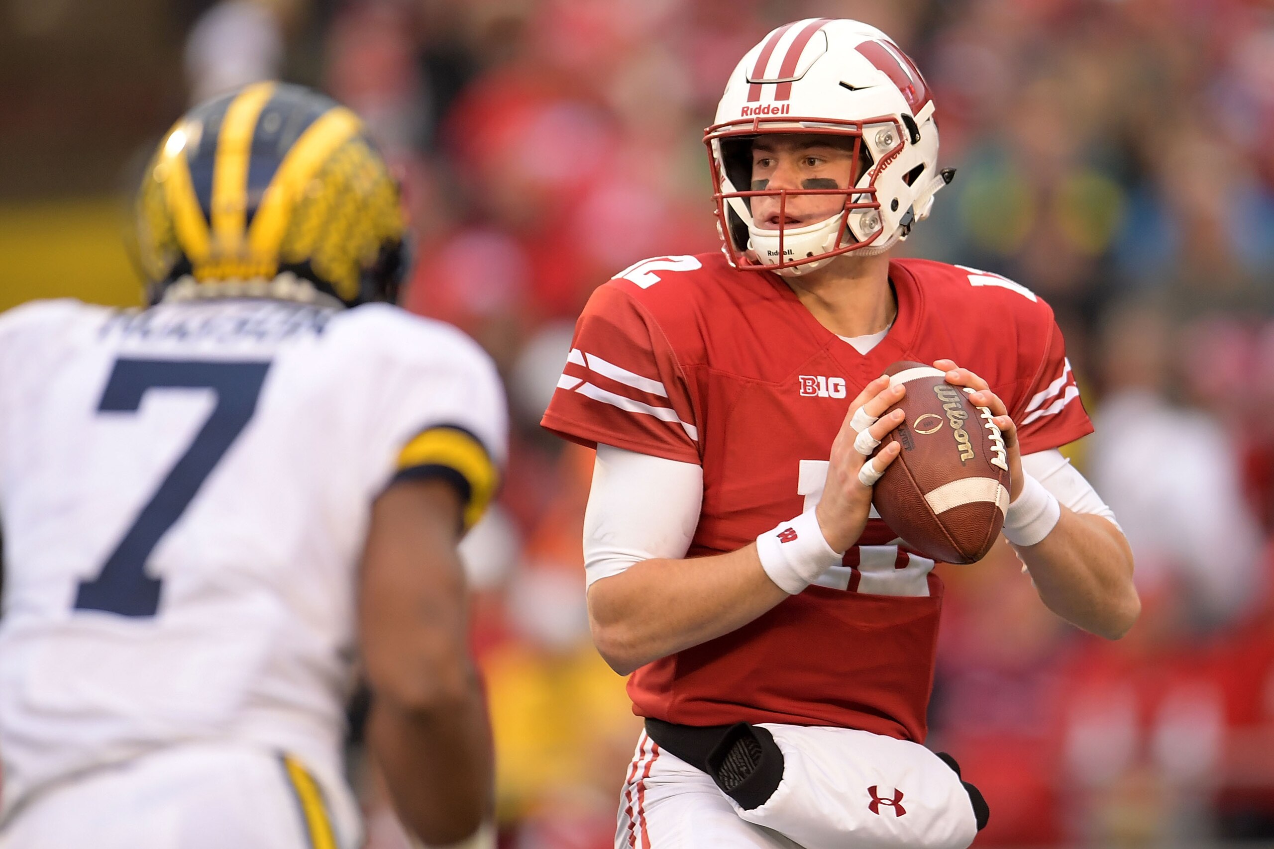 MADISON, WI - NOVEMBER 18:  Alex Hornibrook #12 of the Wisconsin Badgers drops back to pass during a game against the Michigan Wolverines at Camp Randall Stadium on November 18, 2017 in Madison, Wisconsin.  Wisconsin defeated Michigan 24-10.  (Photo by Stacy Revere/Getty Images)