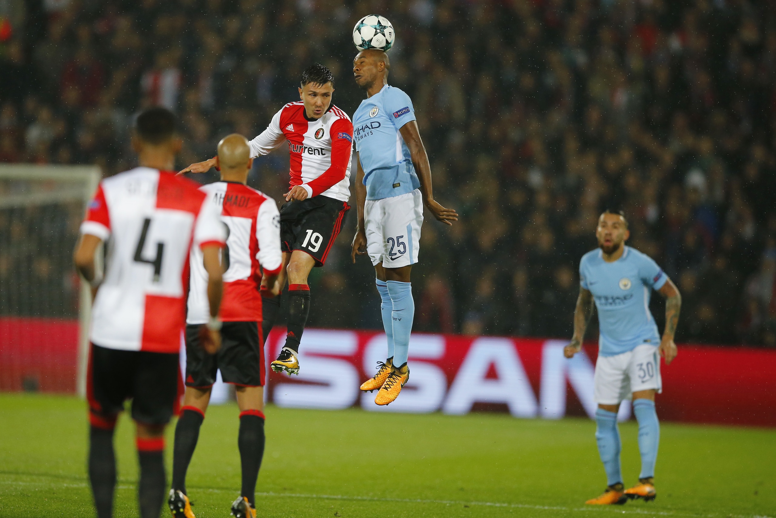 Manchester City's Fernandinho, center right, goes up against Feyenoord's Steven Berghuis, center left, during a Champions League Group F soccer match between Feyenoord and Manchester City at the Kuip stadium in Rotterdam, Netherlands, Wednesday, Sept. 13, 2017. (AP Photo/Peter Dejong) Manchester City's Fernandinho, center right, goes up against Feyenoord's Steven Berghuis, center left, during a Champions League Group F soccer match between Feyenoord and Manchester City at the Kuip stadium in Rotterdam, Netherlands, Wednesday, Sept. 13, 2017. (AP Photo/Peter Dejong)
