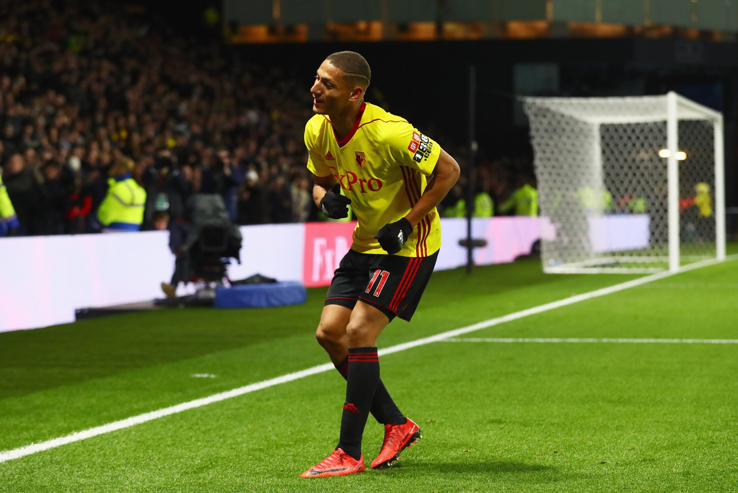 WATFORD, ENGLAND - NOVEMBER 19:  Richarlison de Andrade of Watford dances as he celebrates as he scores their second goal during the Premier League match between Watford and West Ham United at Vicarage Road on November 19, 2017 in Watford, England.  (Photo by Clive Rose/Getty Images)