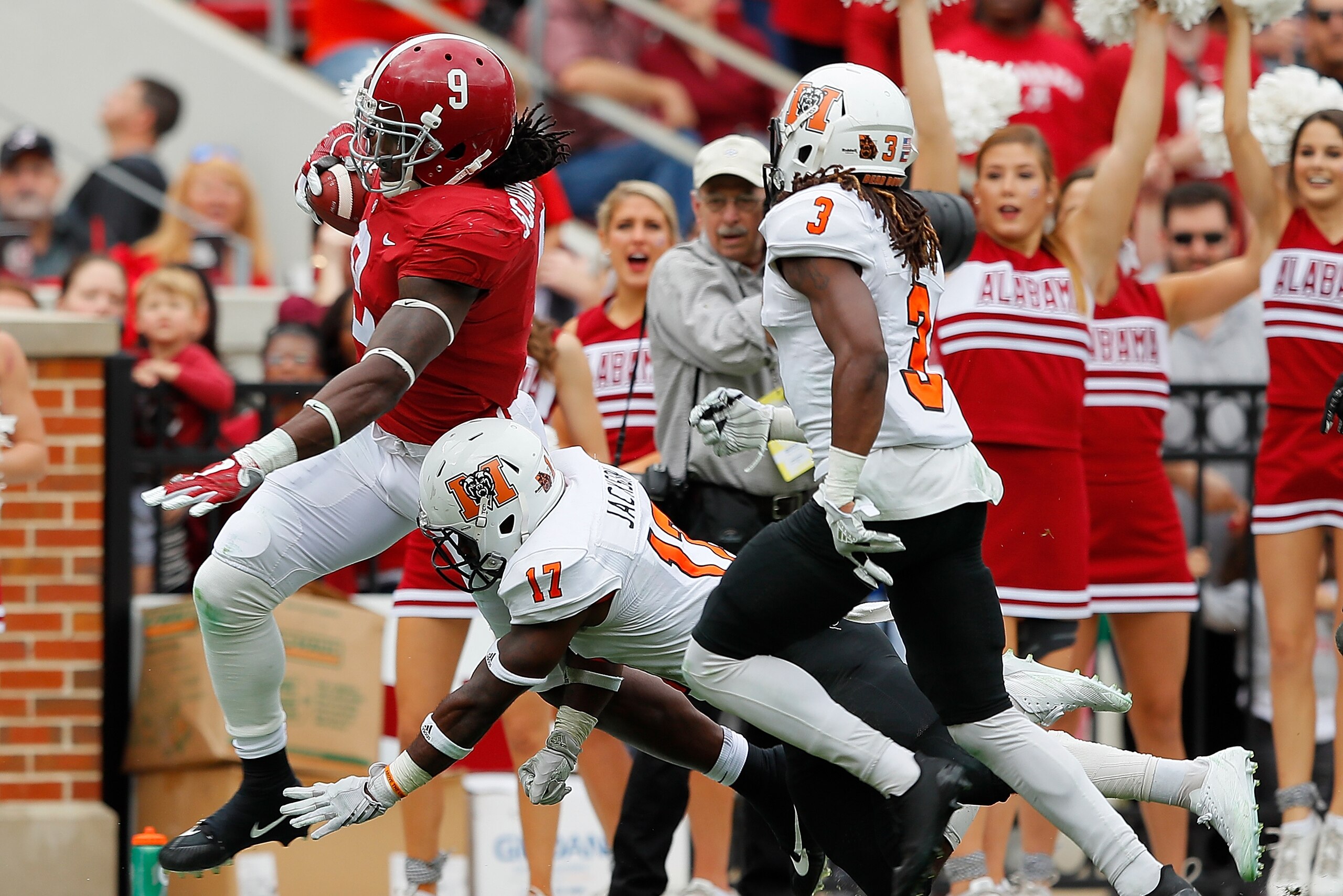 TUSCALOOSA, AL - NOVEMBER 18:  Bo Scarbrough #9 of the Alabama Crimson Tide attempts to break a tackle by Eric Jackson #17 of the Mercer Bears at Bryant-Denny Stadium on November 18, 2017 in Tuscaloosa, Alabama.  (Photo by Kevin C. Cox/Getty Images)