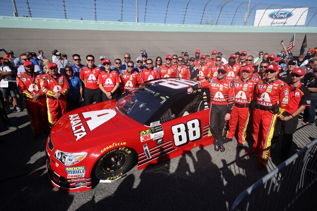 HOMESTEAD, FL - NOVEMBER 19:  Dale Earnhardt Jr., driver of the #88 AXALTA Chevrolet, and his team take part in pre-race ceremonies for the Monster Energy NASCAR Cup Series Championship Ford EcoBoost 400 at Homestead-Miami Speedway on November 19, 2017 in Homestead, Florida.  (Photo by Chris Graythen/Getty Images)