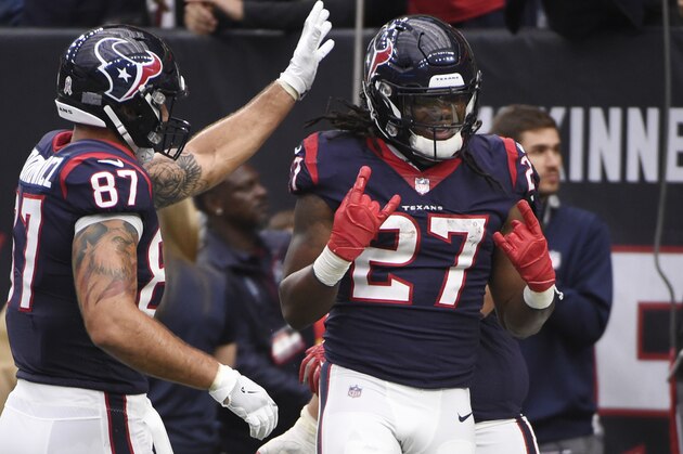 Houston Texans running back D'Onta Foreman (27) celebrates with teammates after a touchdown run during the second half of an NFL football game against the Arizona Cardinals, Sunday, Nov. 19, 2017, in Houston. (AP Photo/Eric Christian Smith)