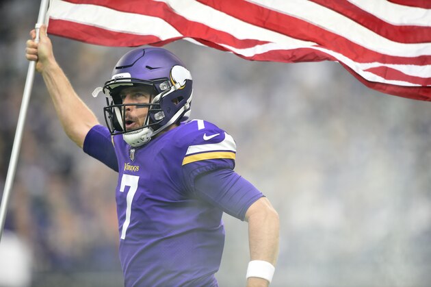 MINNEAPOLIS, MN - NOVEMBER 19: Case Keenum #7 of the Minnesota Vikings carries out an American flag during player introductions before the game against the Los Angeles Rams on November 19, 2017 at U.S. Bank Stadium in Minneapolis, Minnesota. (Photo by Hannah Foslien/Getty Images)