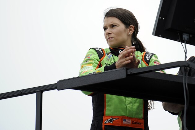 FILE - In this June 1, 2012, file photo, NASCAR Nationwide Series driver Danica Patrick watches from on top of her hauler in Dover, Del. Patrick announced plans Friday, Nov. 17, 2017, to run just 2 races in 2018, the Daytona 500 and the Indianapolis 500, and end her full-time driving career. (AP Photo/Nick Wass, File)