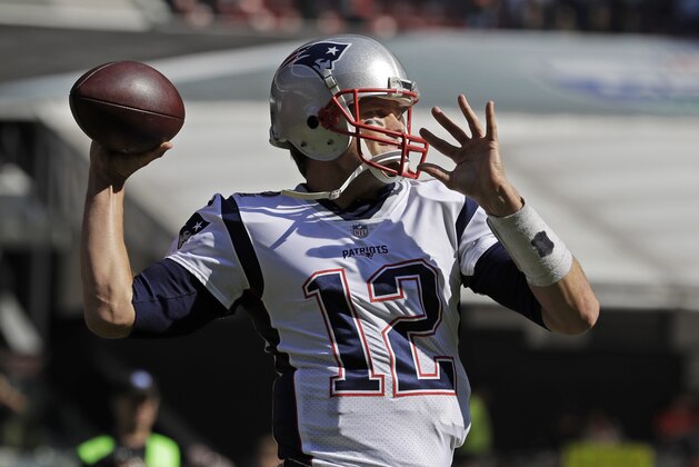 New England Patriots quarterback Tom Brady warms up before an NFL football game against the Oakland Raiders, Sunday, Nov. 19, 2017, in Mexico City. (AP Photo/Rebecca Blackwell)