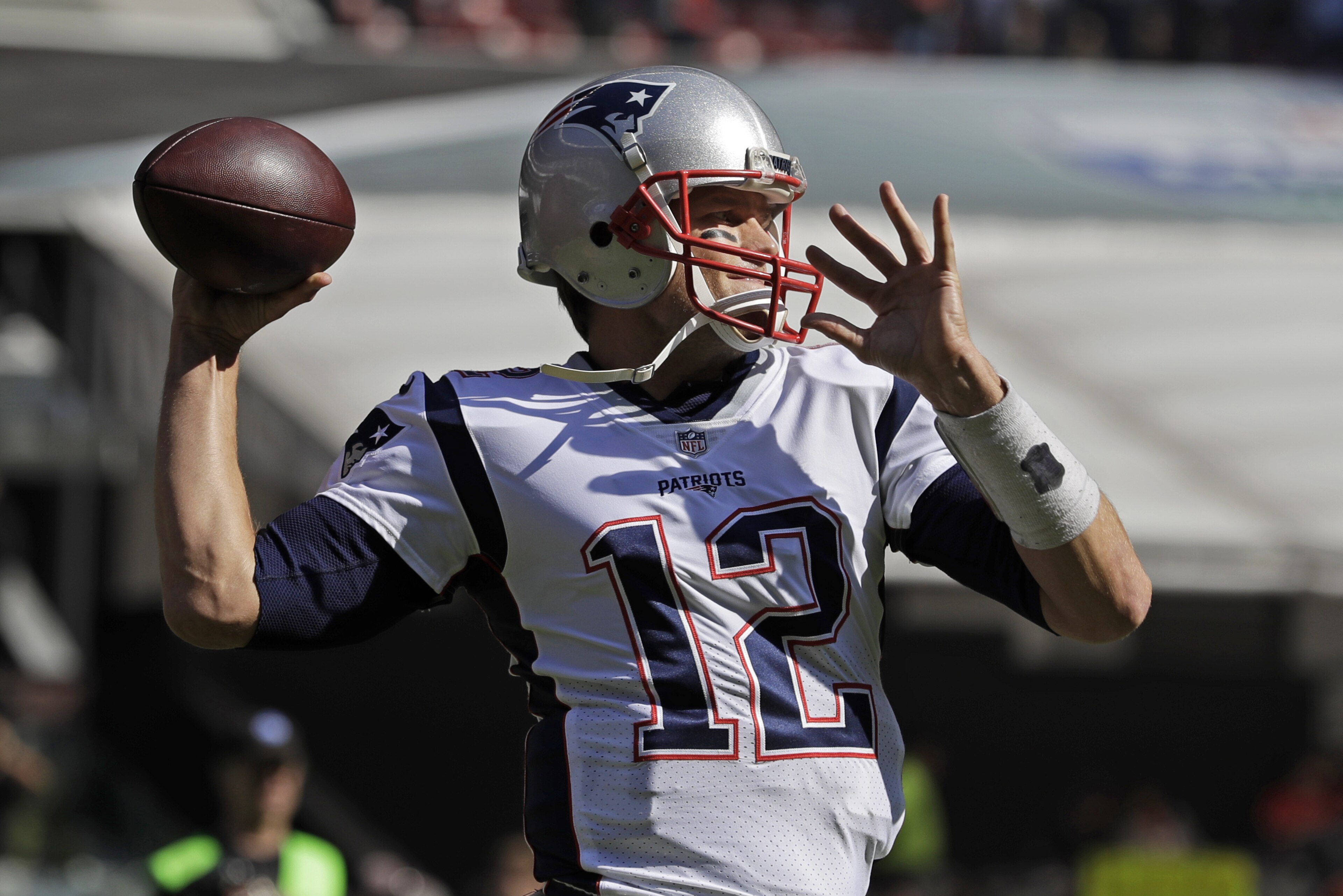 New England Patriots quarterback Tom Brady warms up before an NFL football game against the Oakland Raiders, Sunday, Nov. 19, 2017, in Mexico City. (AP Photo/Rebecca Blackwell)