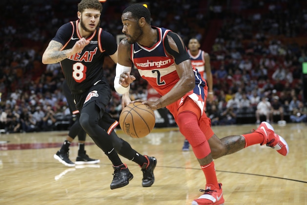Washington Wizards' John Wall (2) drives to the basket as Miami Heat's Tyler Johnson (8) defends during the first half of an NBA basketball game, Wednesday, Nov. 15, 2017, in Miami. (AP Photo/Lynne Sladky)